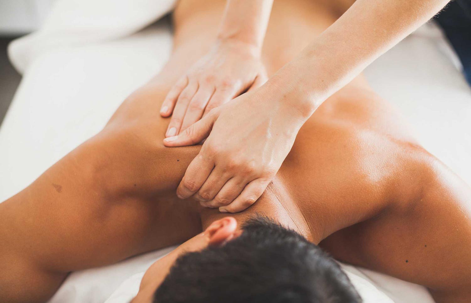 a man receiving a shoulder massage
