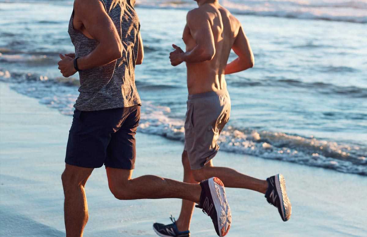 two men running down the beach