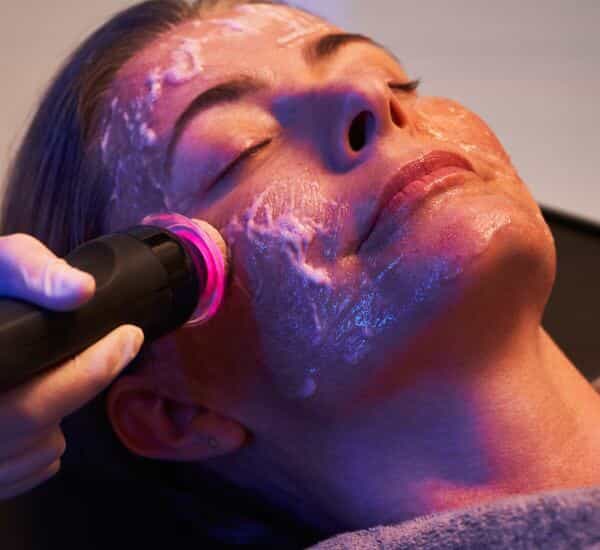 Women getting face treatment
